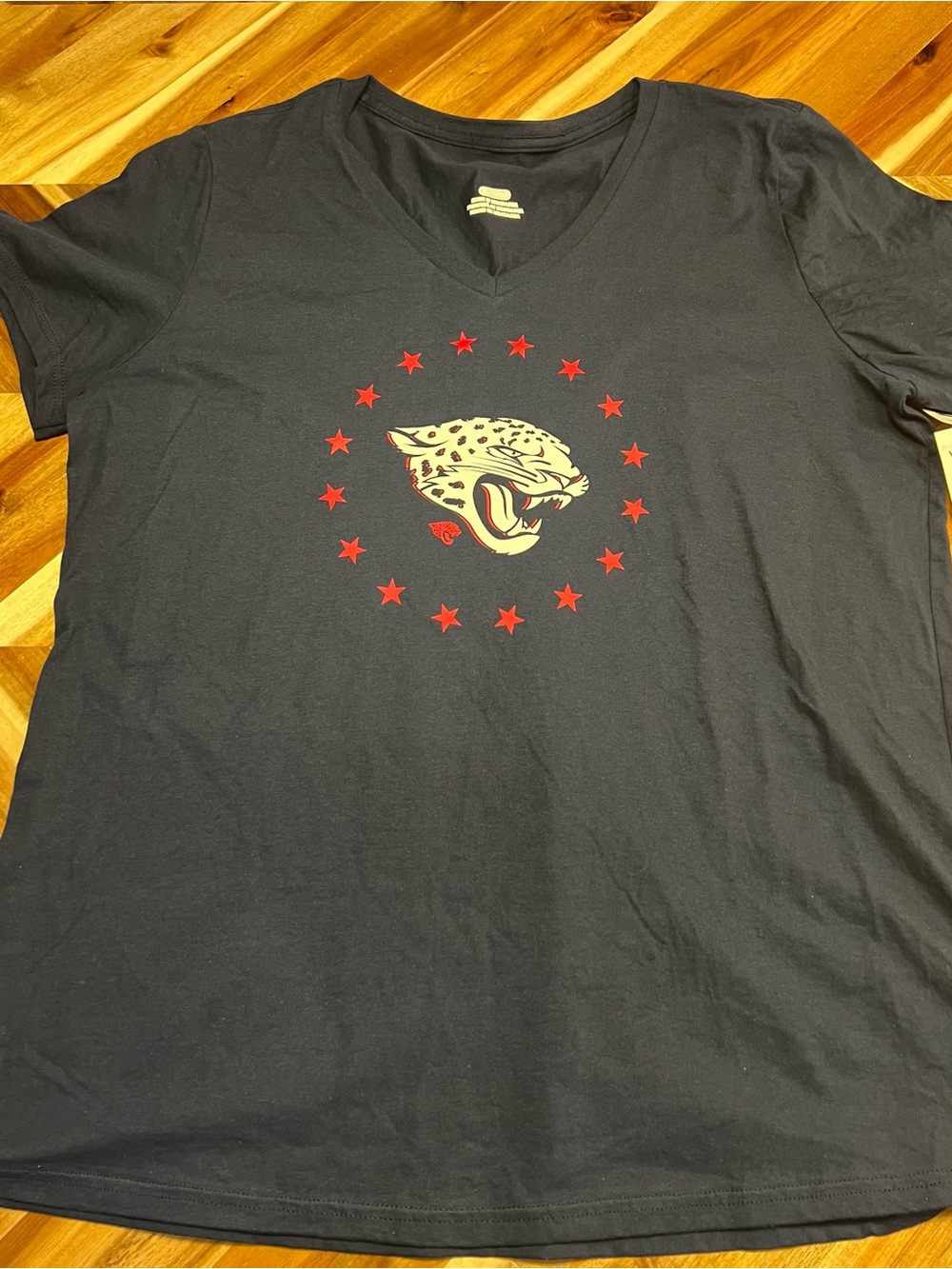 Team Apparel Black V‑Neck Tee with Red Stars and Cream Jaguar
